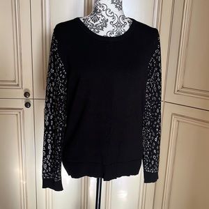 Cute black sweater with rhinestone detail on sleeves